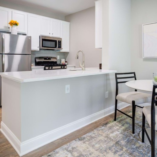 kitchen and dining areas with bright lighting