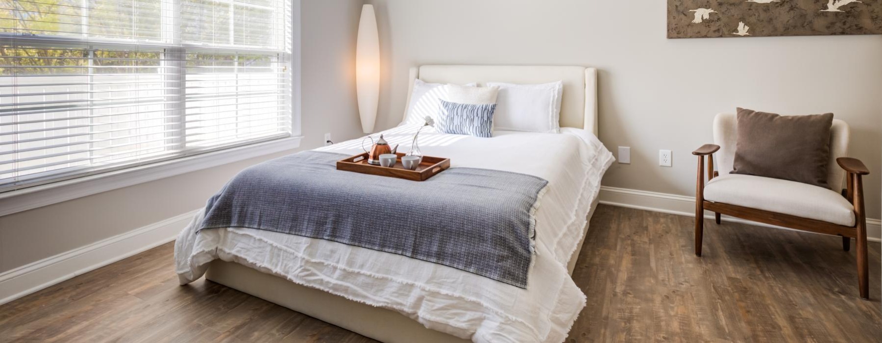 large windows brighten spacious bedroom