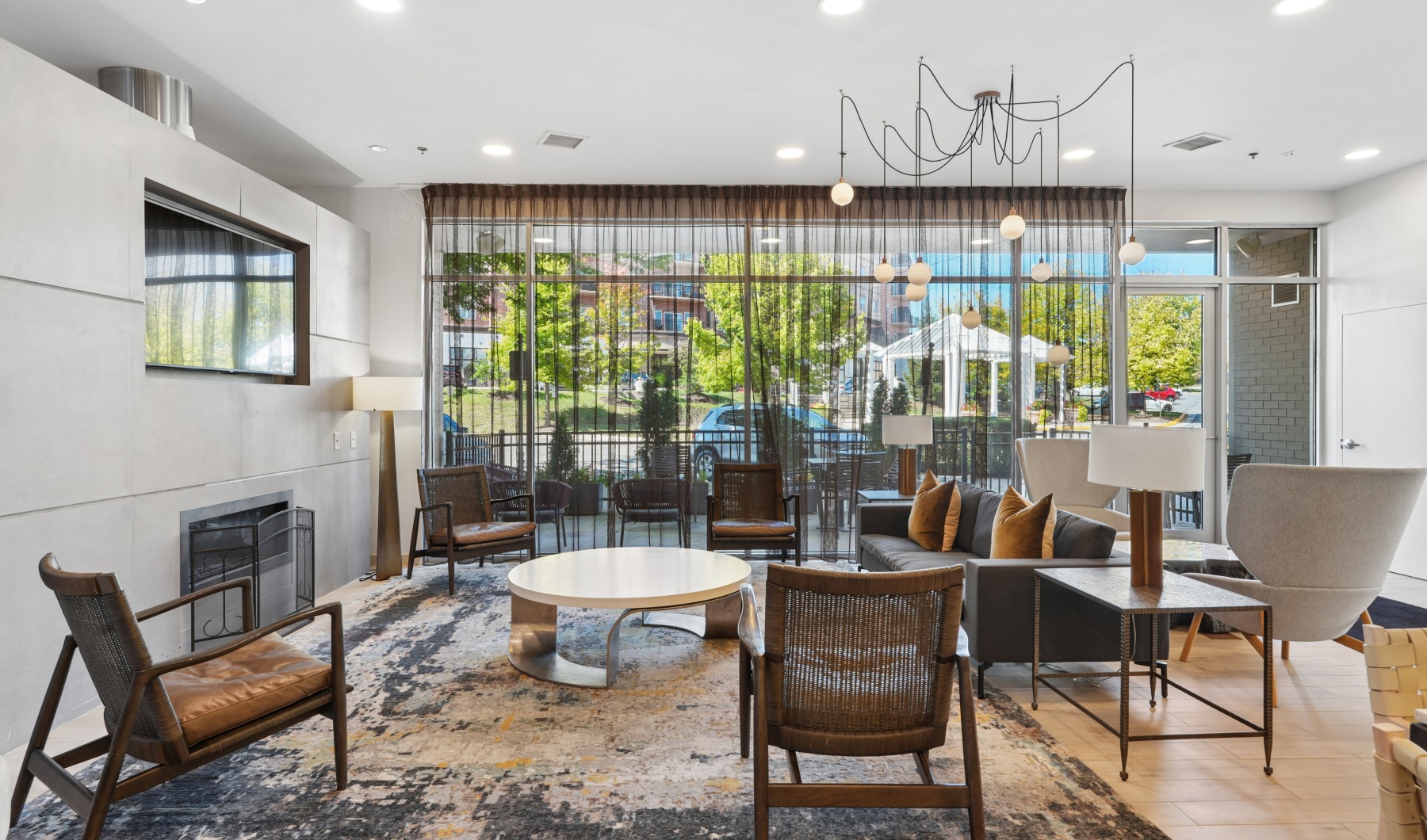 Fireplace seating and kitchen in clubhouse